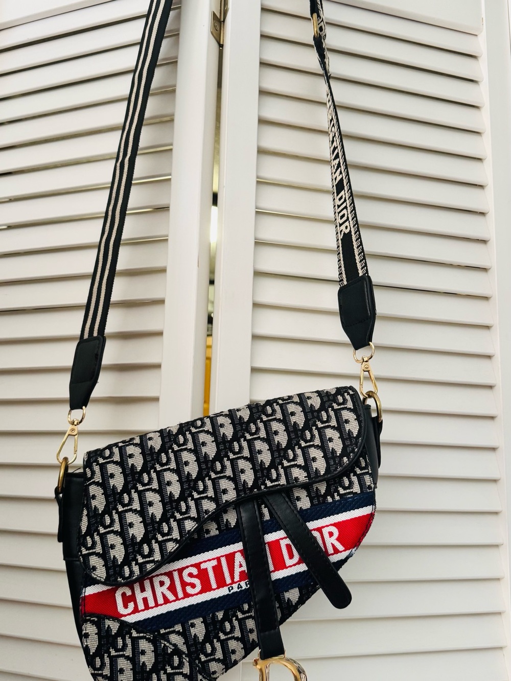 Black & White Oblique Logo Saddle Crossbody with Red Stripe